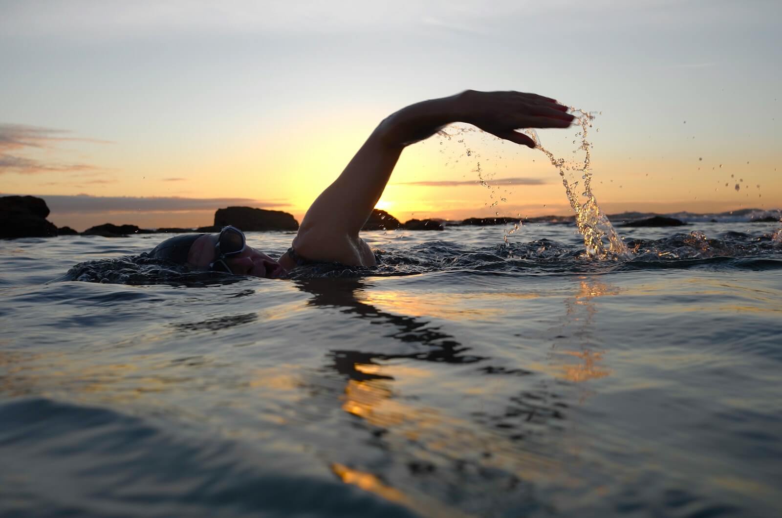 Photo by Dallas Morgan person swimming on body of water